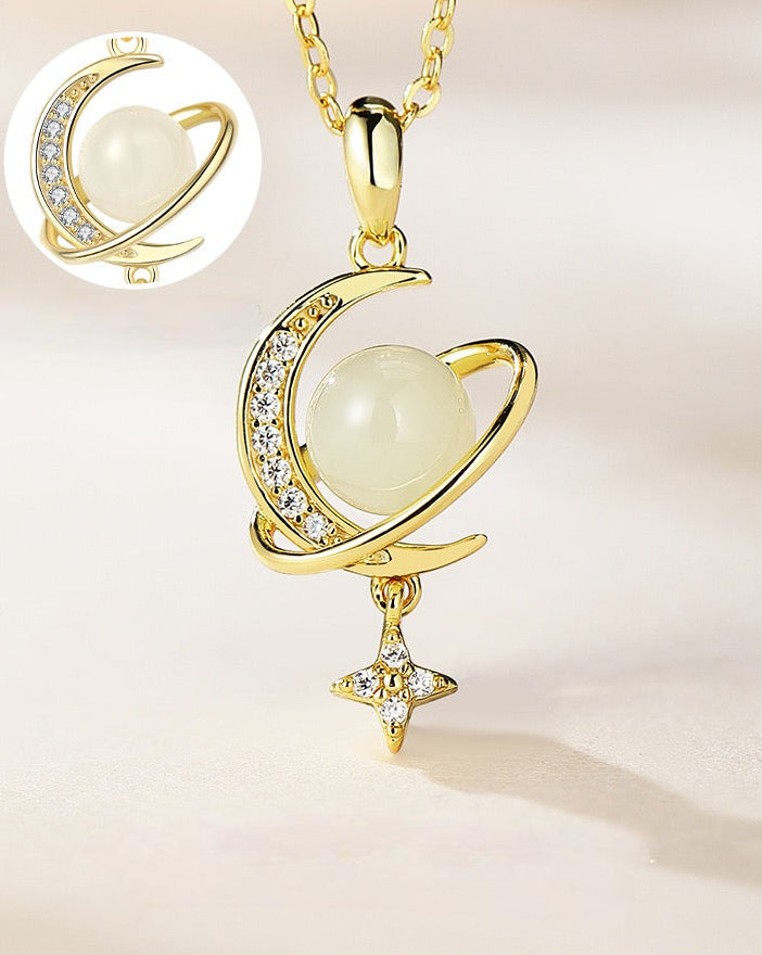 Close up of Hetian jade Lumen pendant showing green jade center, crystal moon and sparkling star design