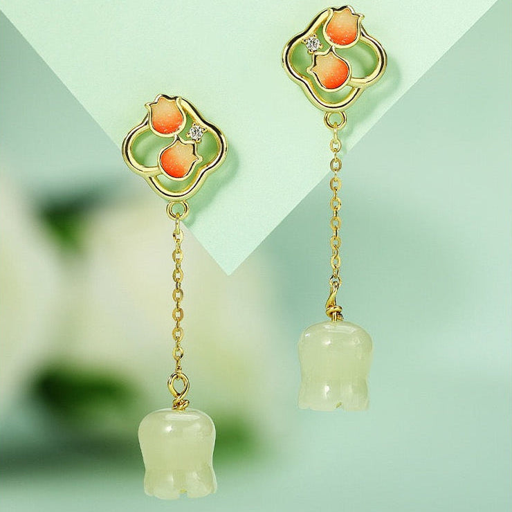 Hetian jade lily of the valley drop earrings with orange enamel flower details and gold plated finish