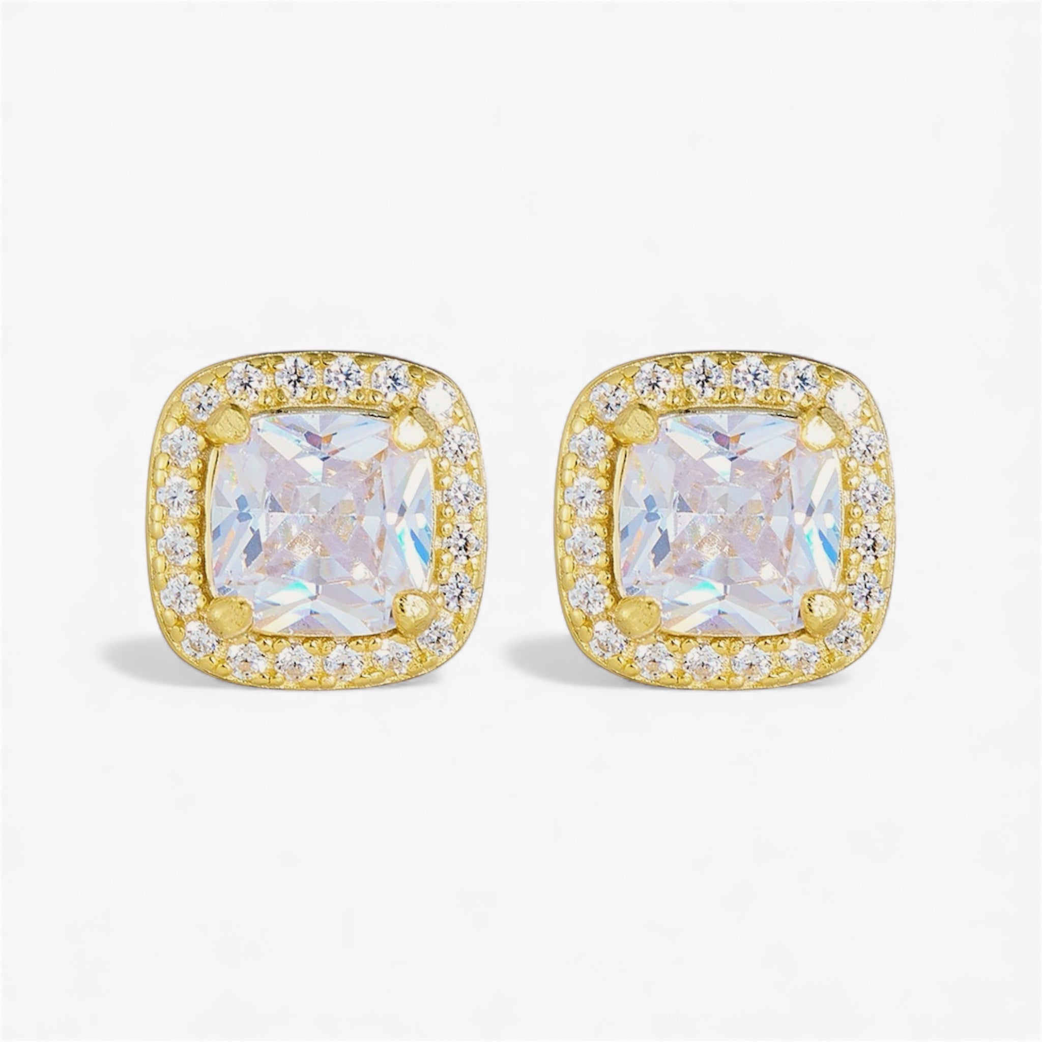 Gold square stud earrings with clear cushion-cut center stones and halo of small crystals