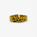 Textured gold open band ring with modern, minimalist design on a white background.