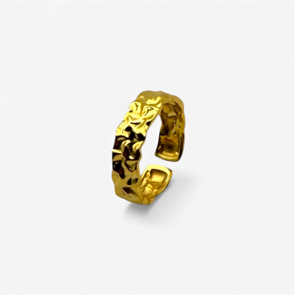 Textured gold open ring with crumpled design on a white background, minimalist jewelry