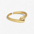 Minimalist gold open band ring with a modern, curved design on a white background