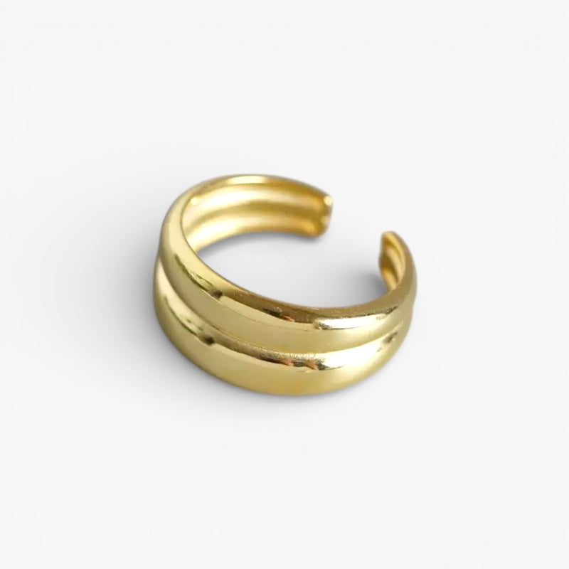 Minimalist gold ear cuff with double band design on white background
