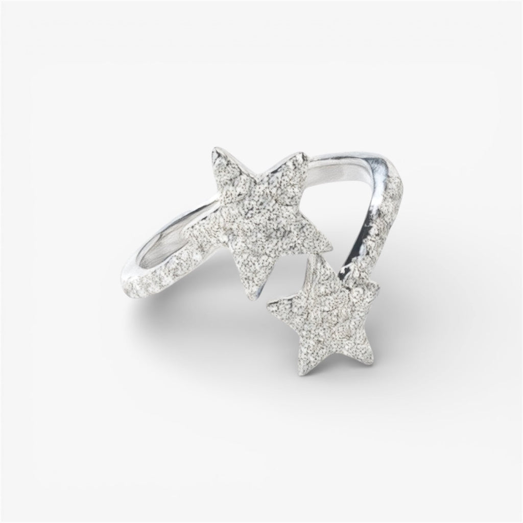 Silver star ring with two textured star accents, minimalist modern jewellery on white background