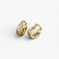Chunky gold twisted hoop earrings, minimalist modern design on white background