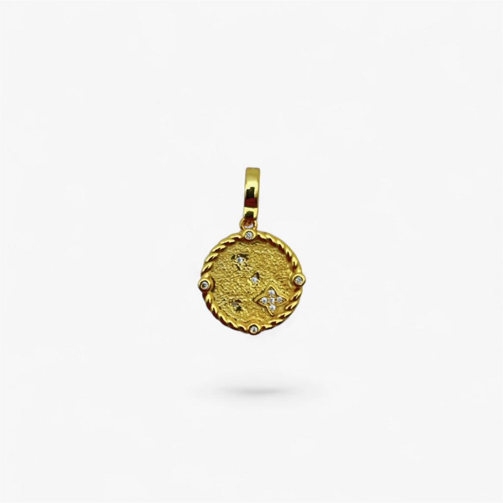 Gold textured coin pendant with small clear gemstones, minimalist modern jewelry