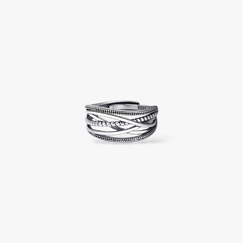 Textured sterling silver braided band ring minimalist modern design on white background