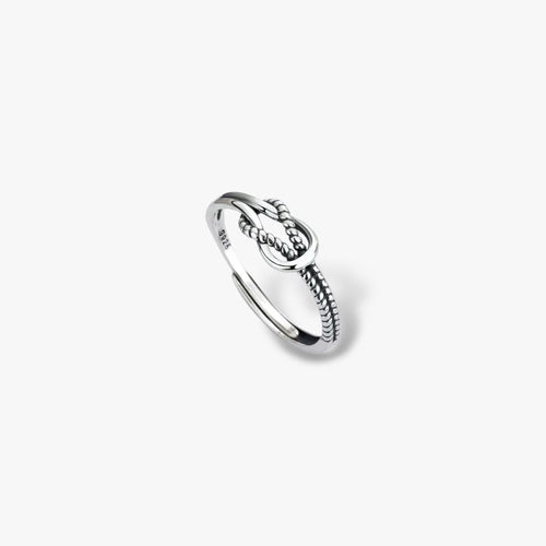 Sterling silver knotted rope detail minimalist ring on white background