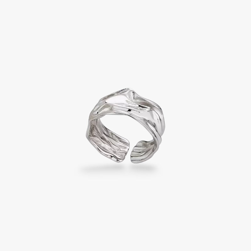 Textured silver open band ring with modern minimalist design on white background