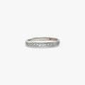 Silver eternity ring with embedded crystal stones.