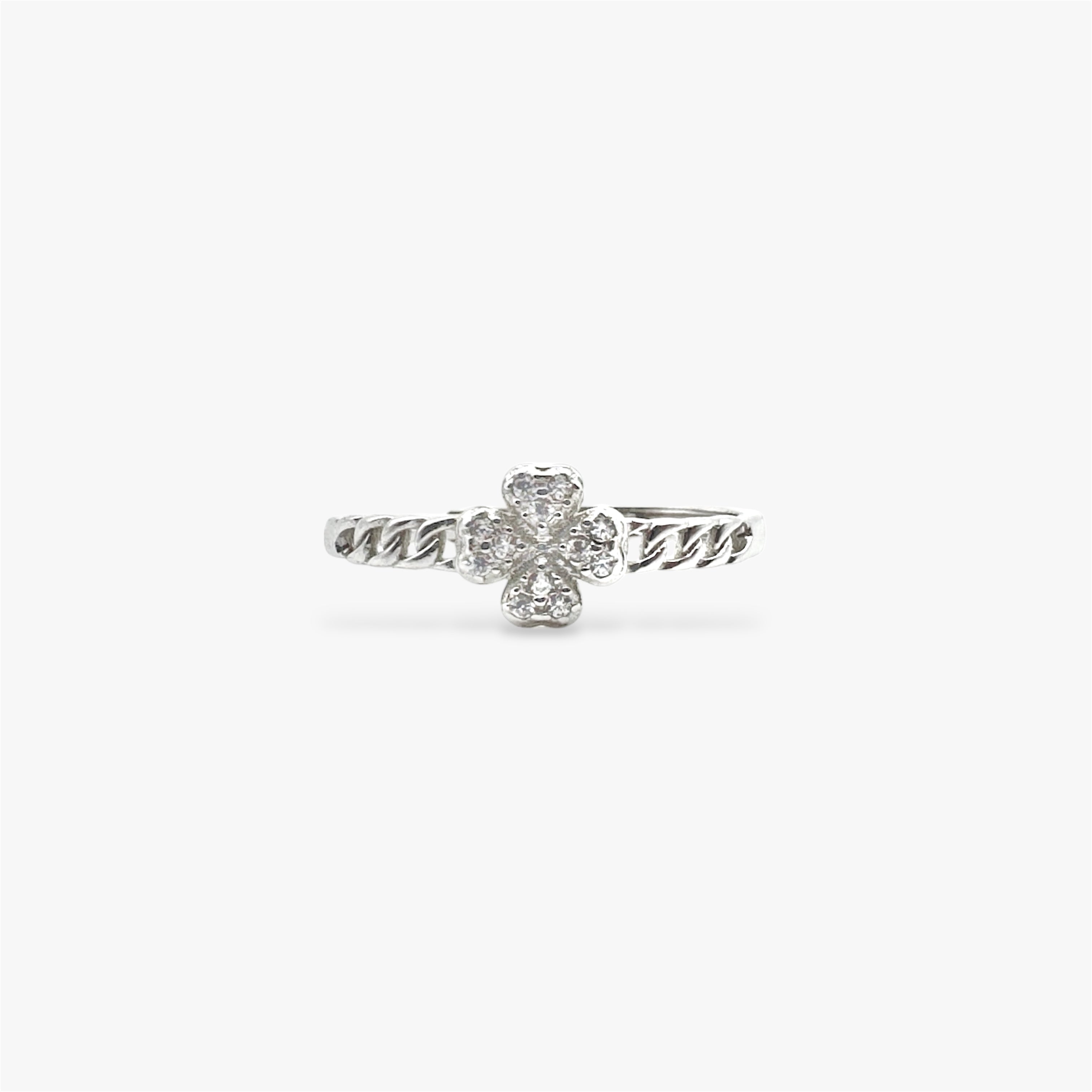 Four leaf clover silver ring with crystals with a small cuban band design.