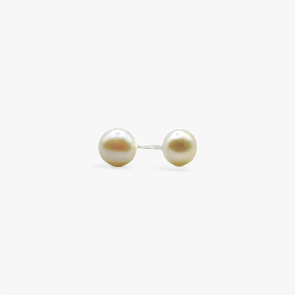 Close up of rhodium plated sterling silver pearl stud earrings with round freshwater pearls